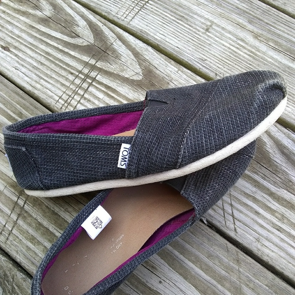 Toms black and silver slip ons